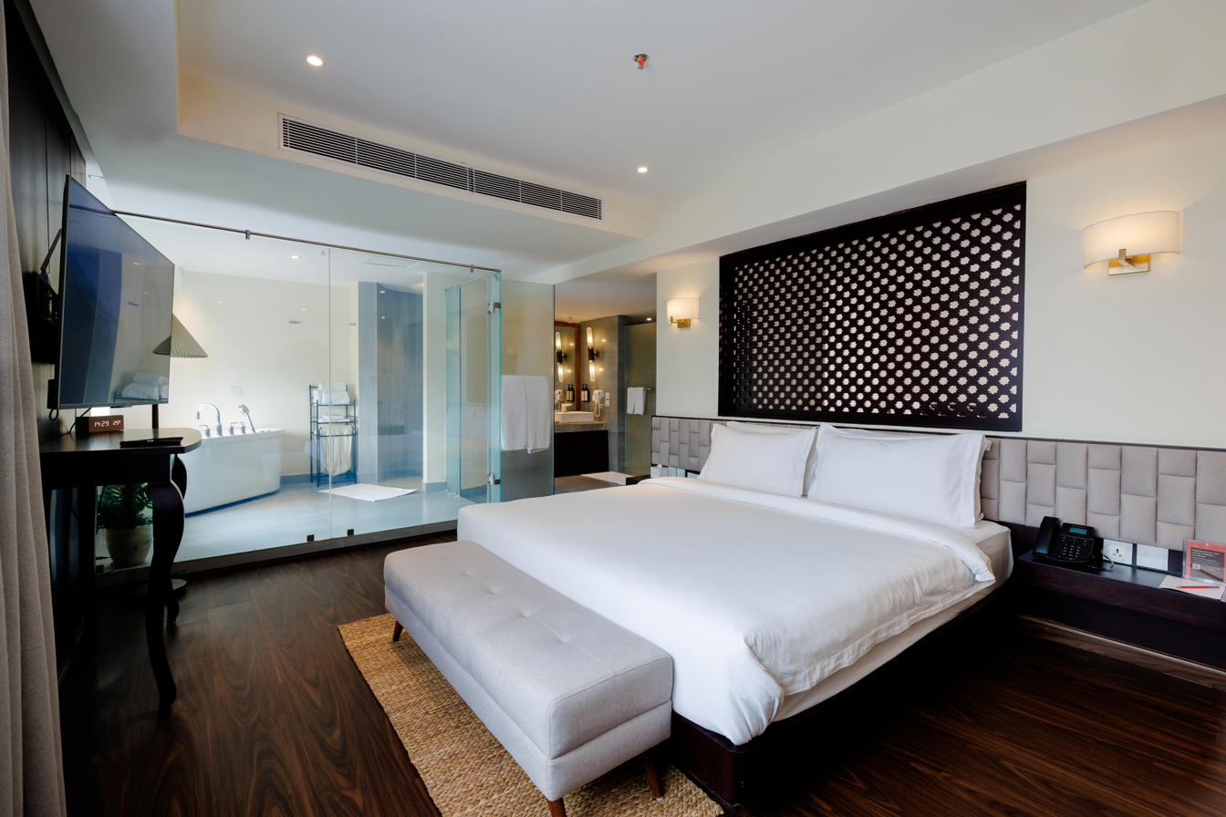 Latticed headboard and rubberwood furniture in a suite